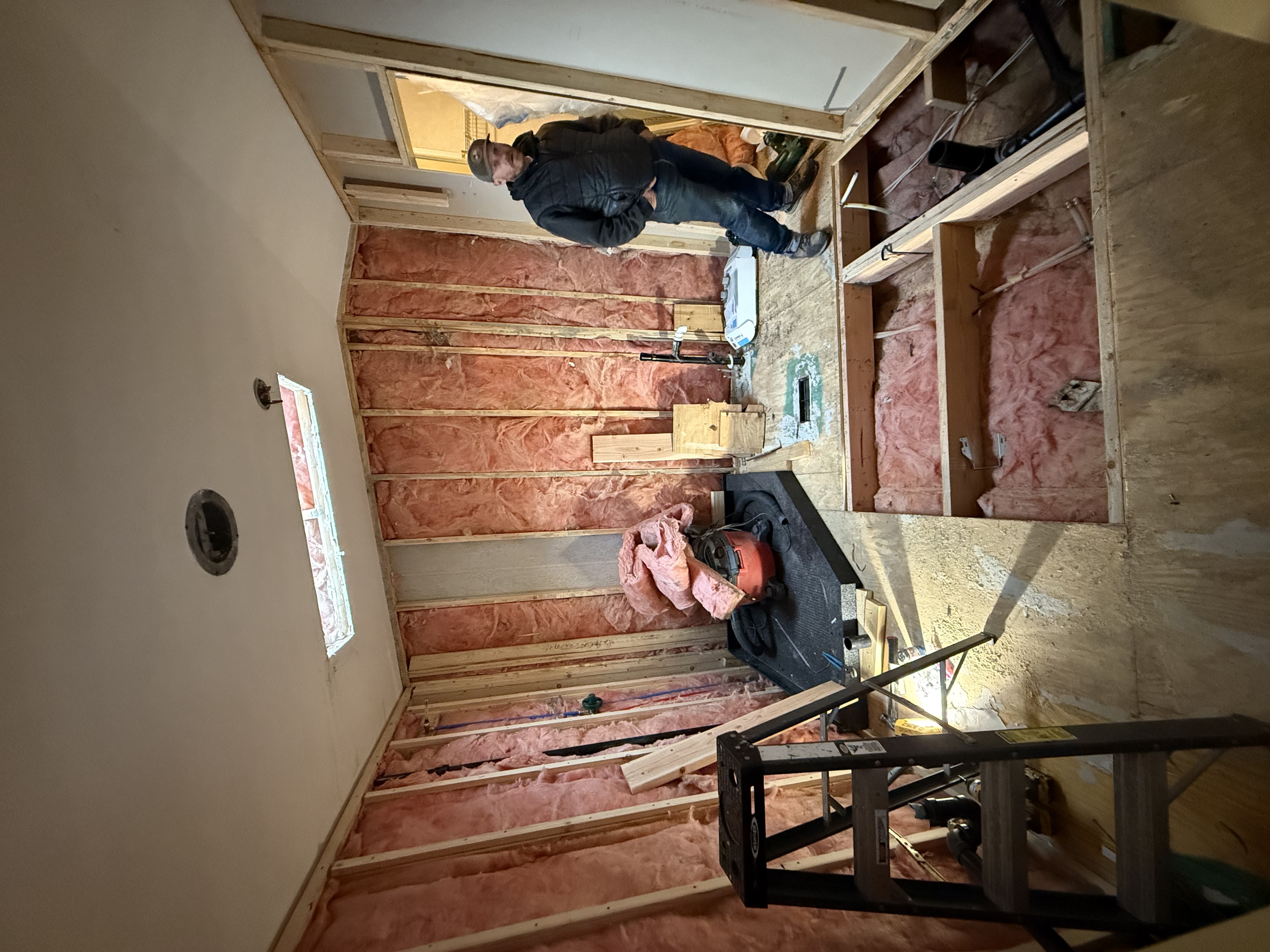 Basement remodel in progress in Colorado Springs with framing and insulation